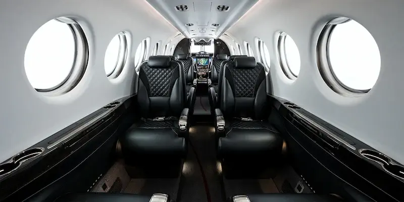 Luxury executive cabin interior with premium leather seating inside a Beechcraft King Air charter aircraft
