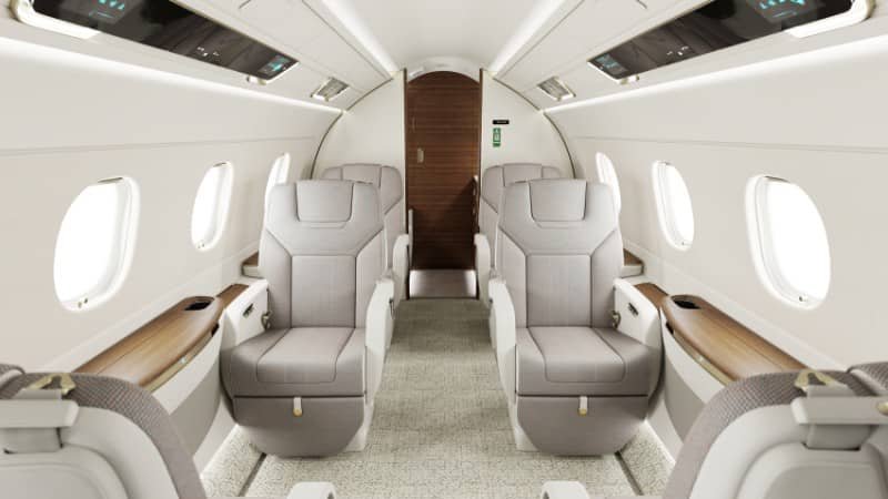 Premium leather club seating arrangement and executive cabin layout inside an Embraer Praetor 500 private aircraft