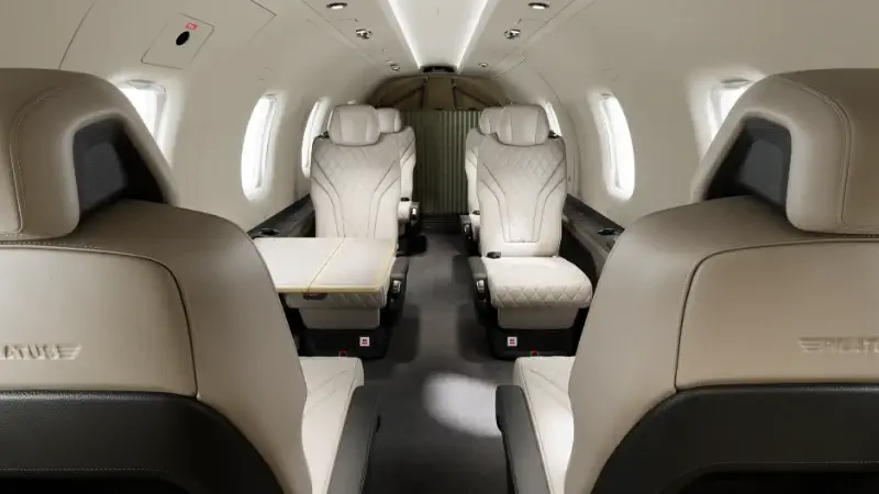 Versatile executive cabin interior with flat floor and leather seating layout inside a Pilatus PC-12 turboprop aircraft